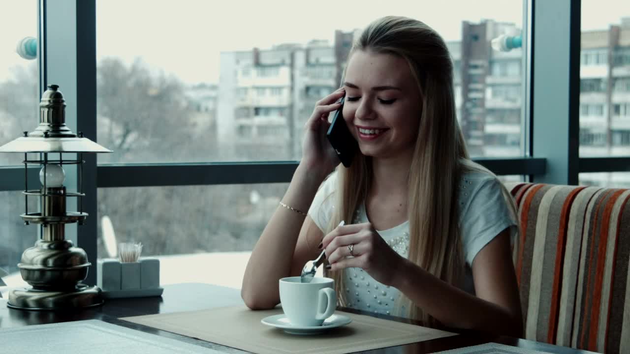 Download Stock Footage Woman Talking On The Phone In The Coffee Shop Live Wallpaper Free