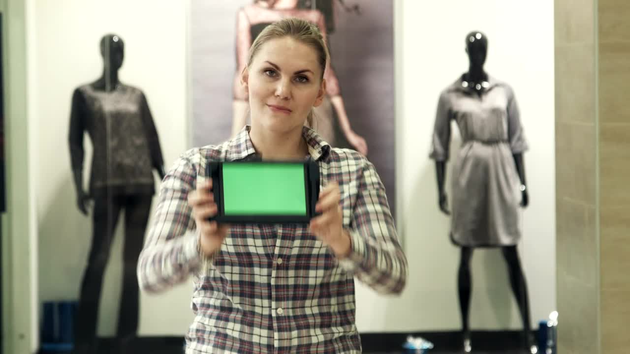 Download Stock Footage Woman Showing A Tablet With A Green Screen Live Wallpaper Free