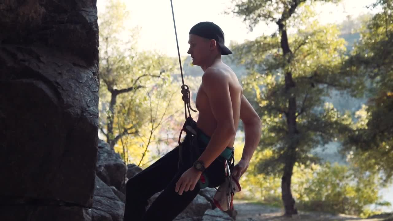 Download Stock Footage Young Shirtless Climber Starts To Climb Live Wallpaper Free