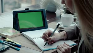Download Stock Footage Writing A Note On A Notebook And Using Tablet Live Wallpaper Free