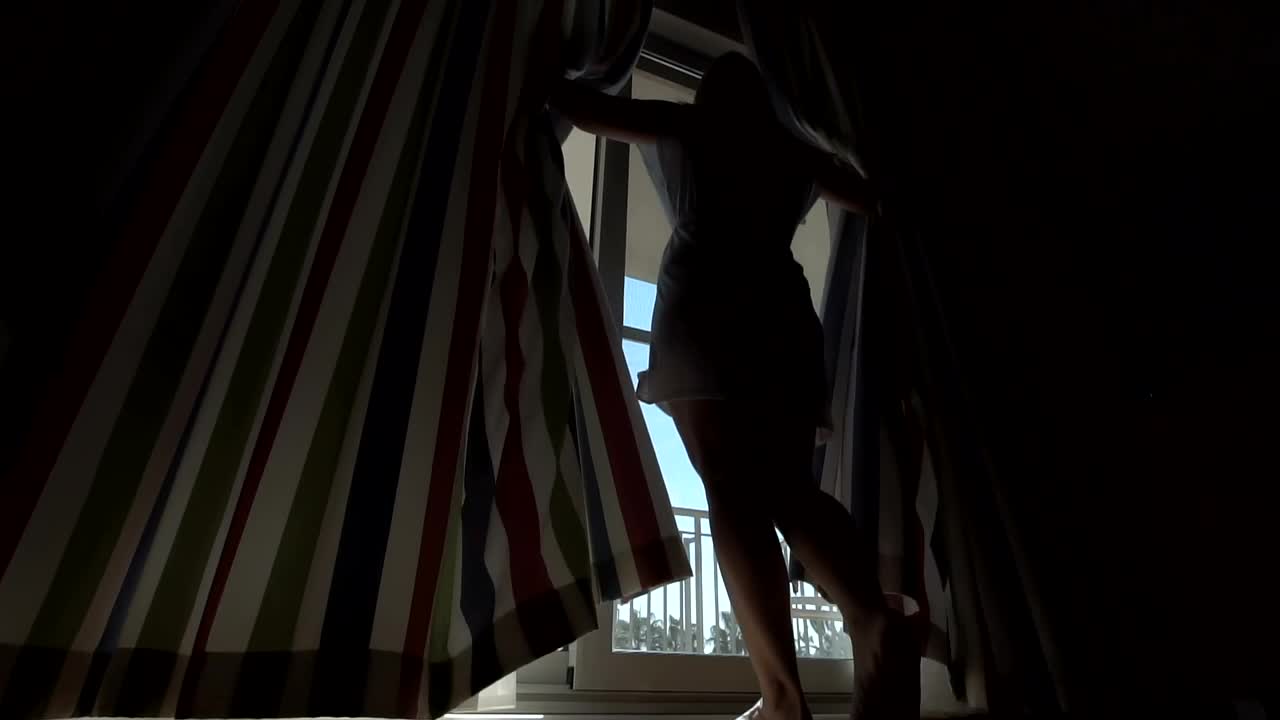 Download Stock Footage Woman Opening The Curtains Live Wallpaper Free