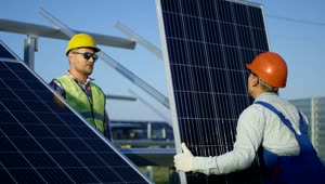 Download Stock Footage Workers Installing A Solar Panel Outdoors Live Wallpaper Free