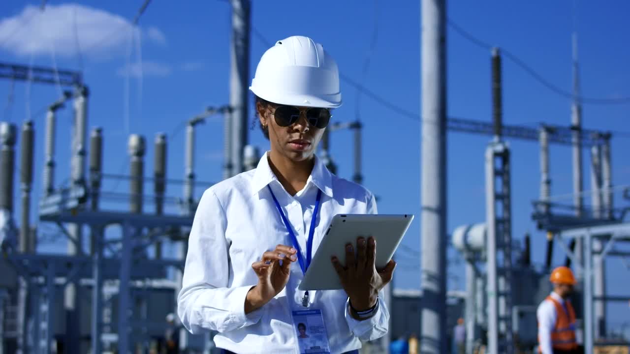 Download Stock Footage Woman Working With Tablet In Power Plant Live Wallpaper Free