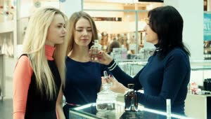 Download Stock Footage Young Woman Smelling Perfume On The Mall Live Wallpaper Free