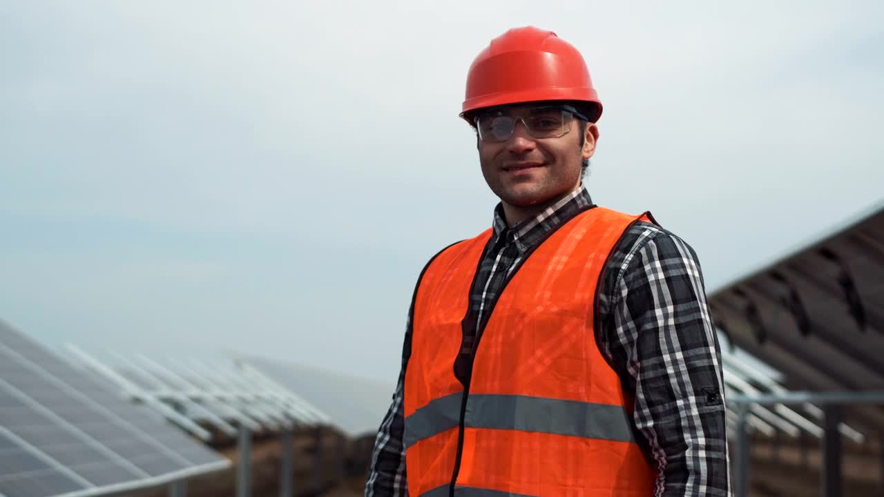 Download Stock Footage Worker Posing In A Solar Panel Field Live Wallpaper Free