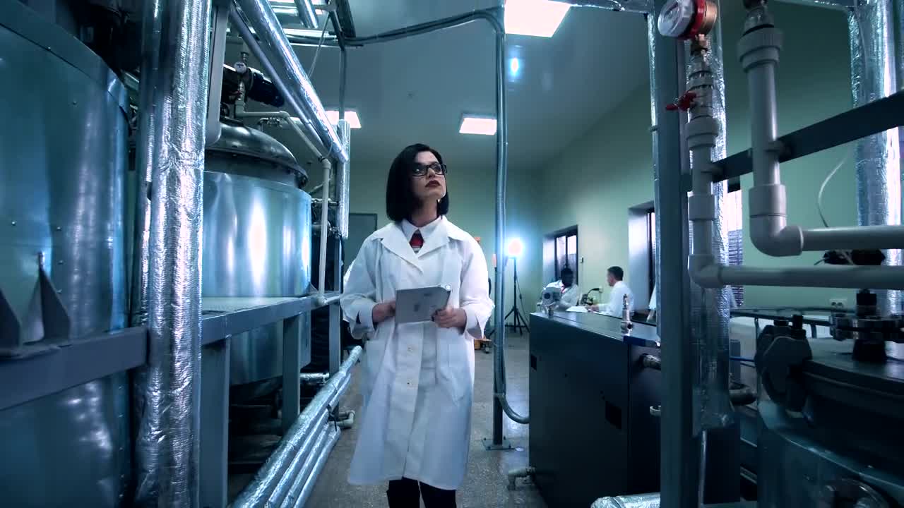 Download Stock Footage Woman With A Tablet In The Laboratory Live Wallpaper Free