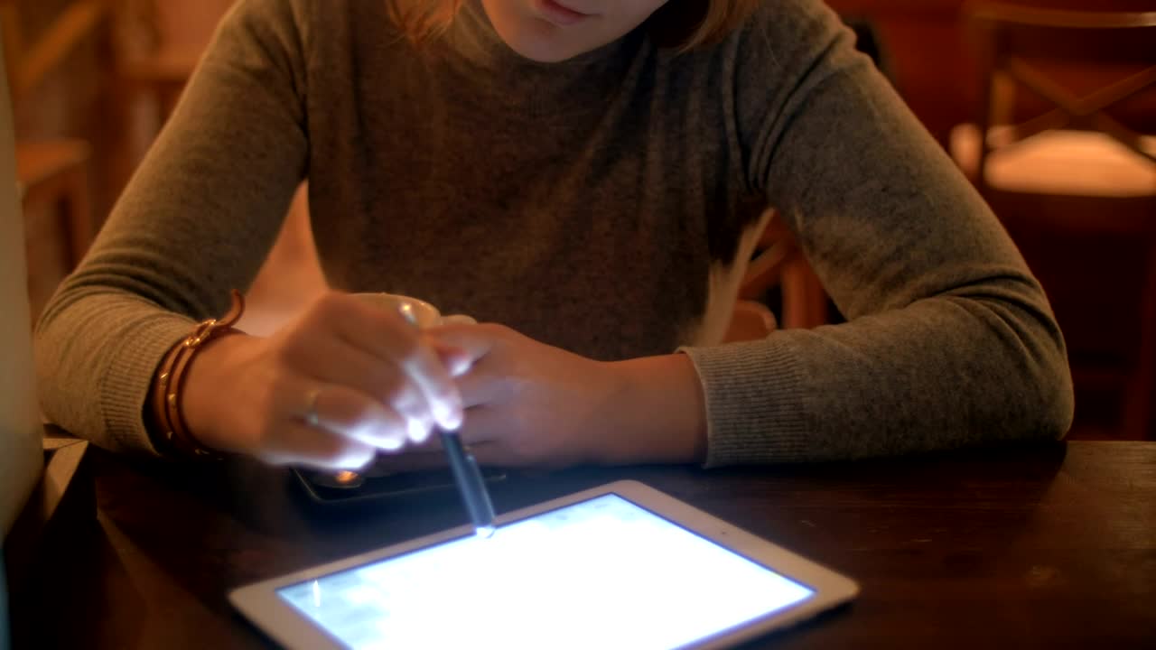 Download Stock Footage Woman Drinking Tea And Using A Tablet Live Wallpaper Free