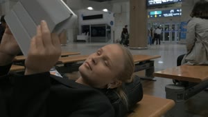Download Stock Footage Woman Waiting During A Flight Delay Live Wallpaper Free