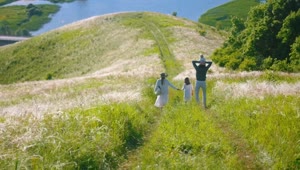 Download Stock Footage Young Family Walking On A Road At The Hill Live Wallpaper Free