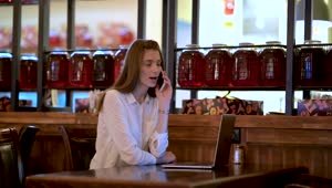Download Stock Footage Woman Talking On The Phone In The Cafe Live Wallpaper Free