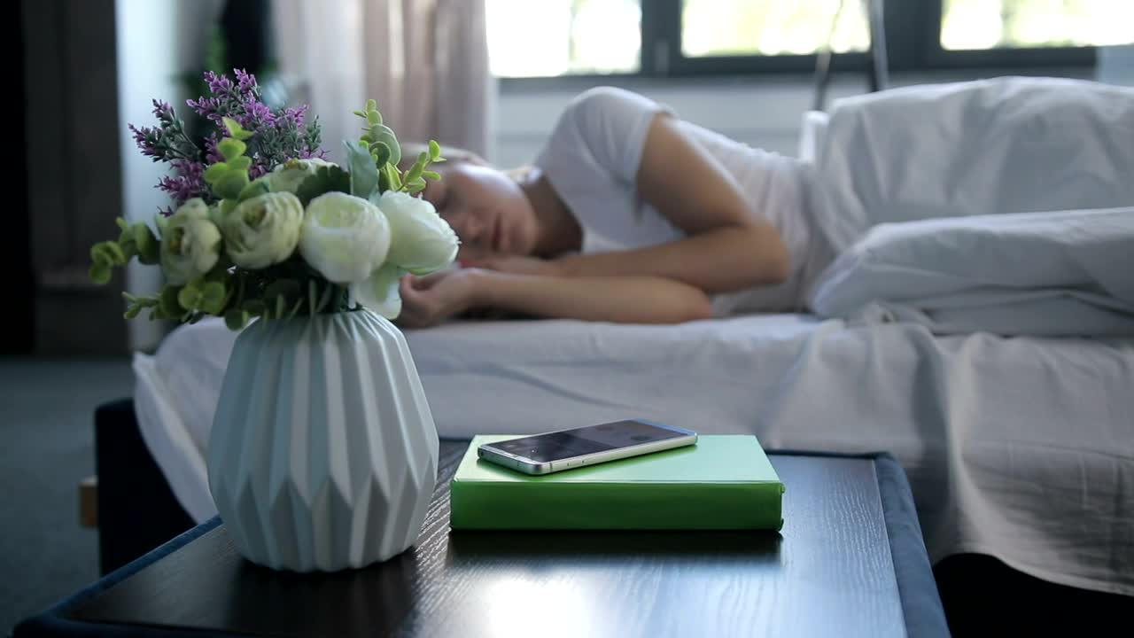 Download Stock Footage Woman Switching Off Her Alarm Live Wallpaper Free