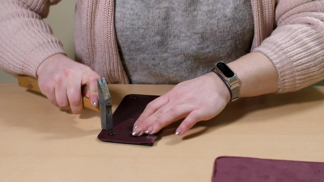 Download Stock Footage Woman Repairing A Wallet Live Wallpaper Free