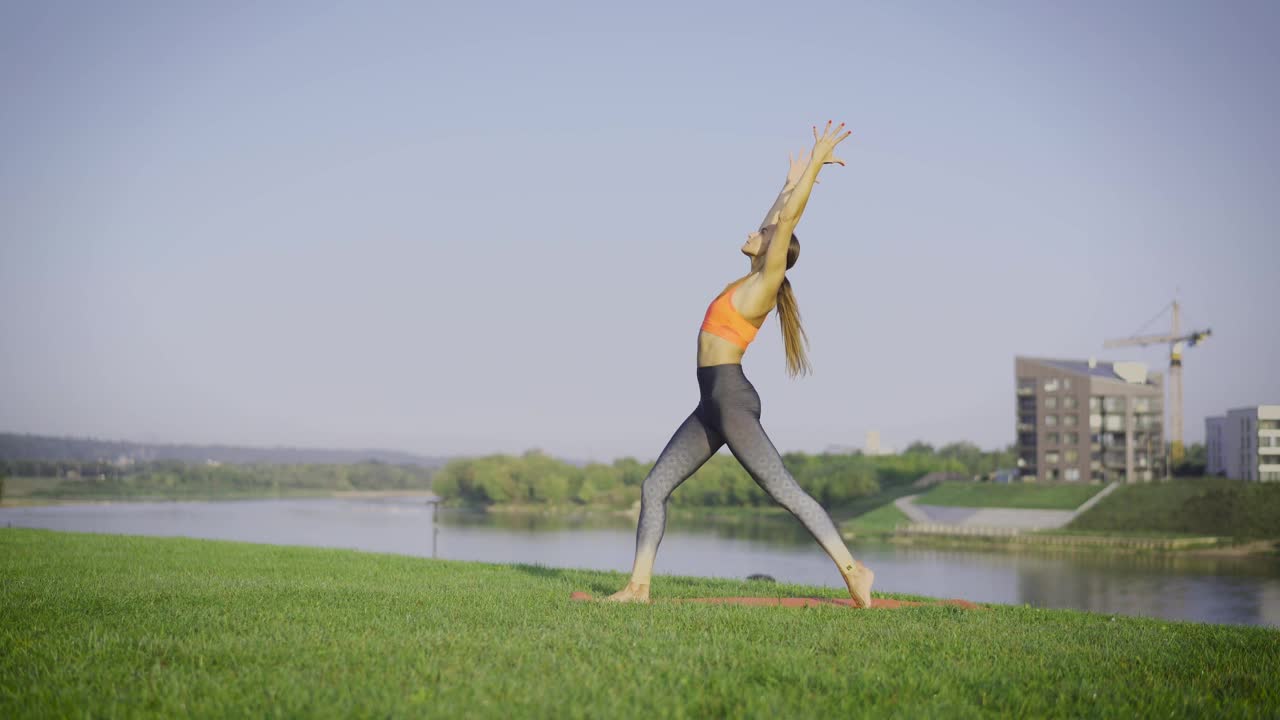 Download Stock Footage Woman Doing Yoga On The Grass Live Wallpaper Free