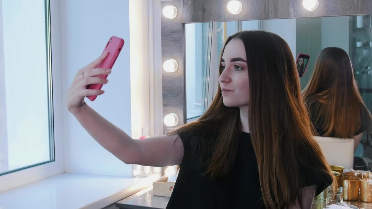 Download Stock Footage Young Brunette Woman Taking A Selfie At The Beauty Salon Live Wallpaper Free