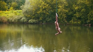 Download Stock Footage Young Man Enjoying A Lake Swing Live Wallpaper Free