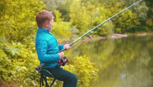 Download Stock Footage Young Boy With A Fishing Rod At The Lake Live Wallpaper Free