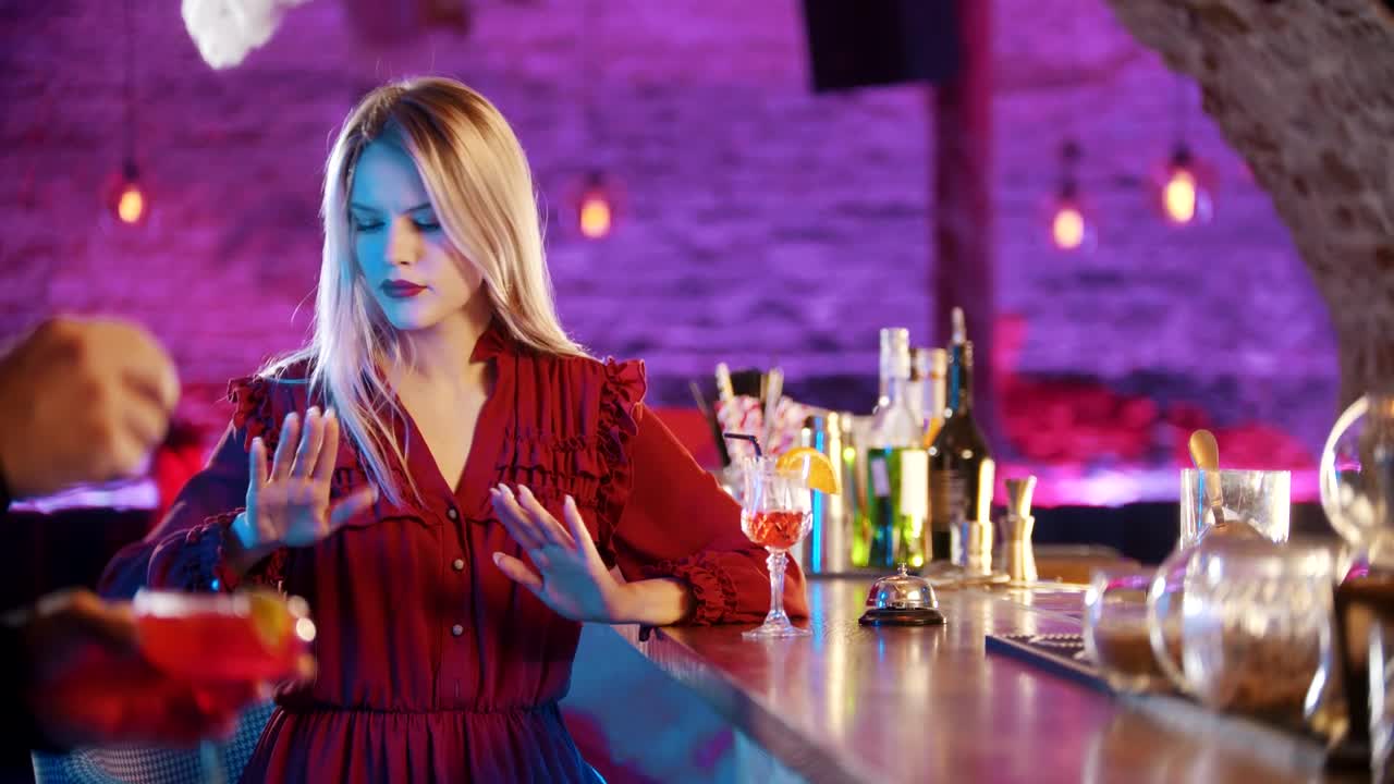 Download Stock Footage Young Woman By The Bartender Stand And Cheking Out Her Live Wallpaper Free