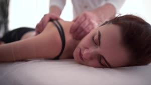 Download Stock Footage Woman Receives Massage Treatment For Shoulder Injury Live Wallpaper Free