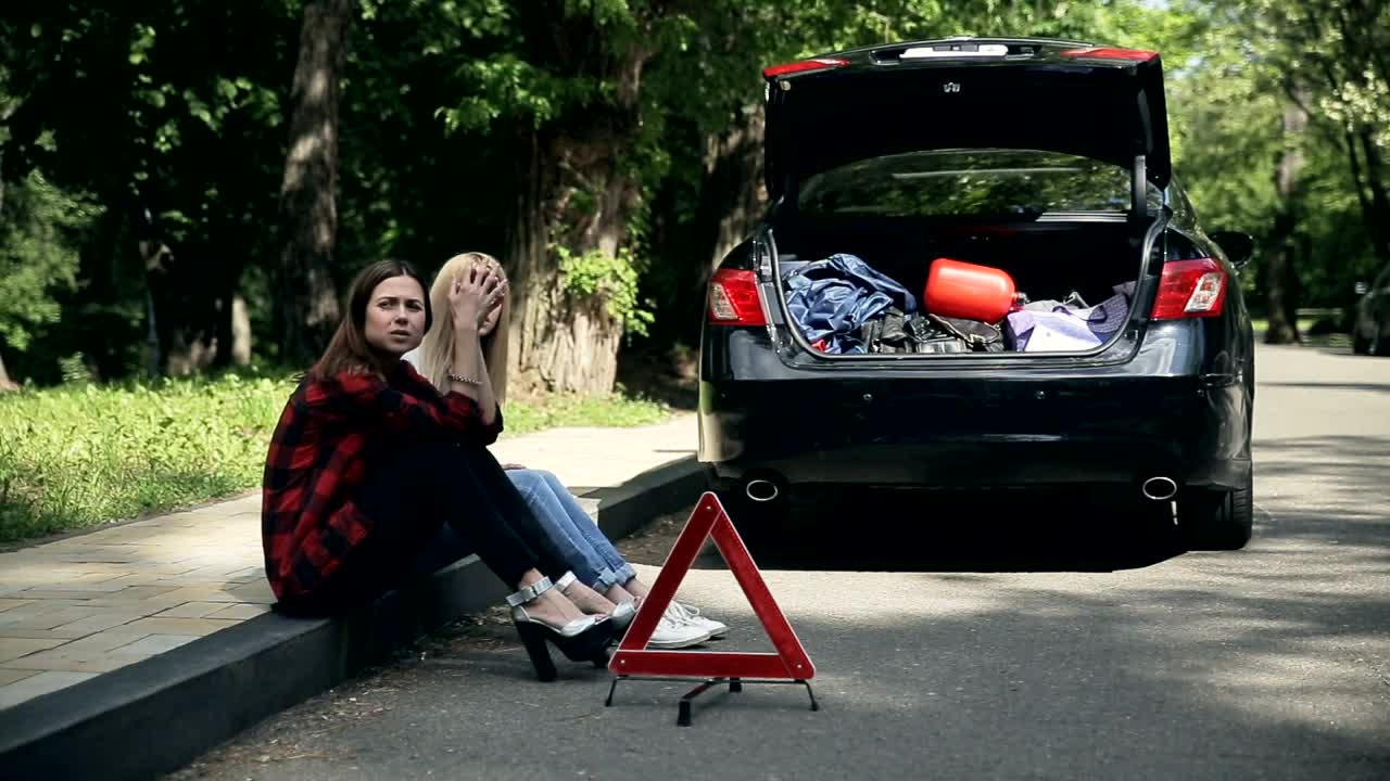 Download Stock Footage Young Women Sit On Curb After Auto Accident Live Wallpaper Free