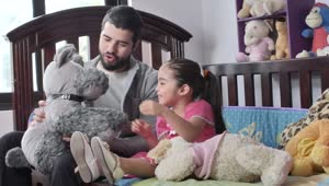 Download Stock Footage Young Dad Playing With Stuffed Animals With His Daughter Live Wallpaper Free