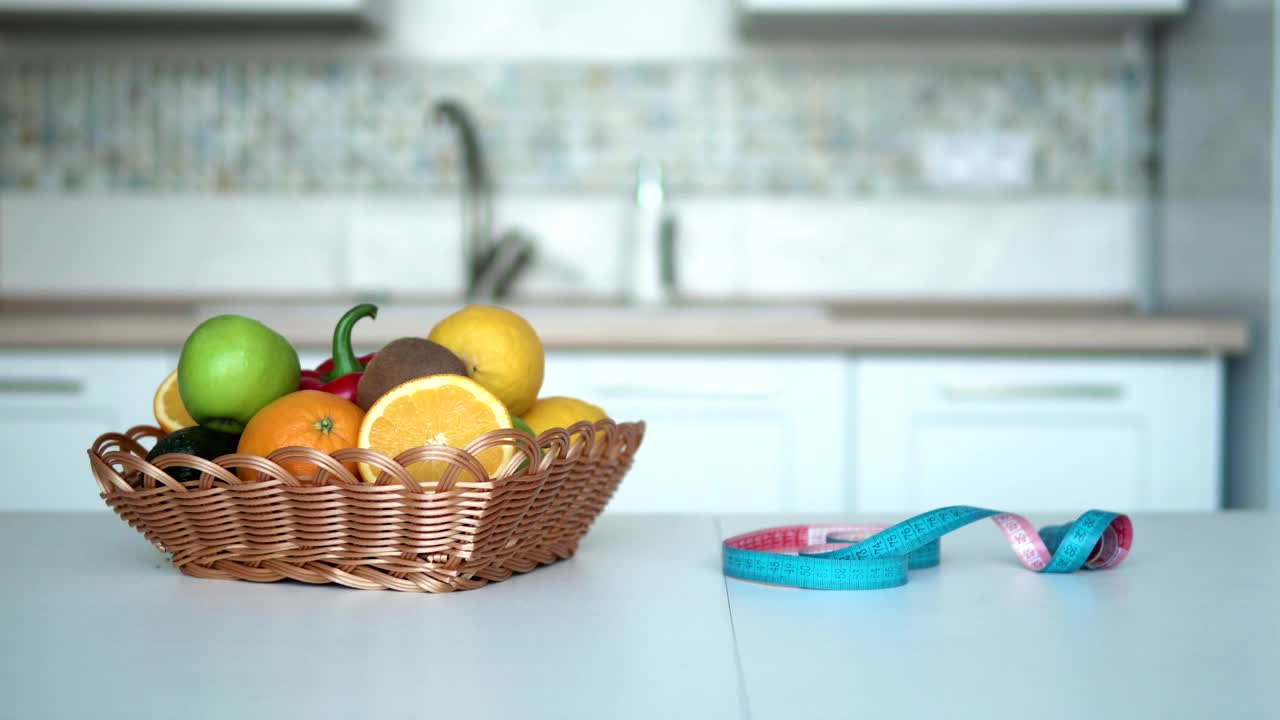 Download Stock Footage Woman Measures Weight Loss Progress In Kitchen Live Wallpaper Free