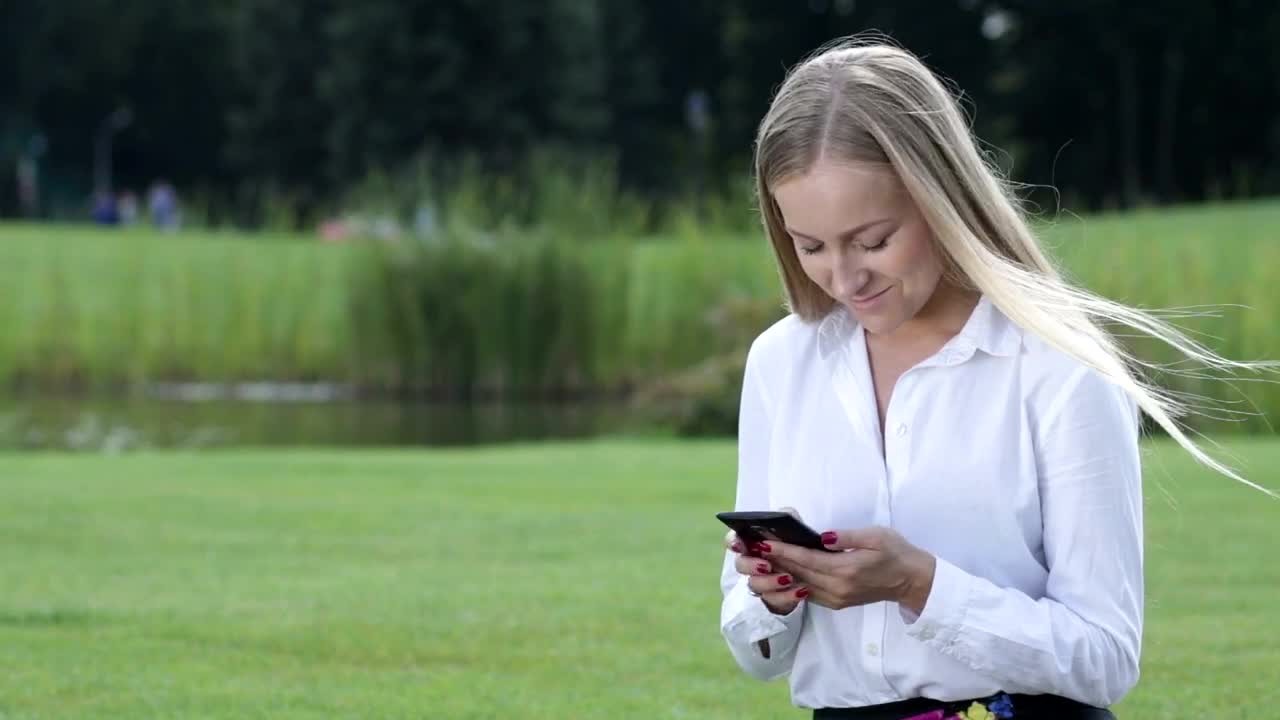 Download Stock Footage Young Woman Working From Her Phone Live Wallpaper Free