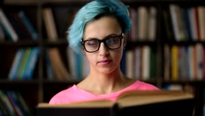 Download Stock Footage Woman With Glasses Reading A Book Live Wallpaper Free
