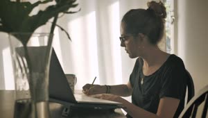 Download Stock Footage Young Woman Working Remotely Live Wallpaper Free