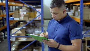 Download Stock Footage Young Worker Doing Inventory Live Wallpaper Free