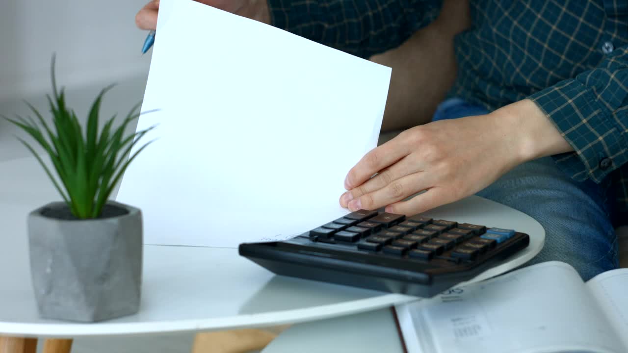 Download Stock Footage Woman Doing Accounts On A Calculator Live Wallpaper Free