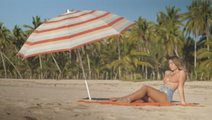 Download Stock Footage Young Woman Sunbathing On The Beach Live Wallpaper Free