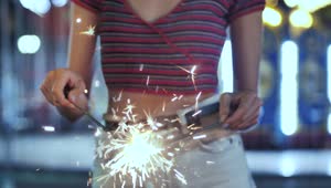 Download Stock Footage Woman Holding A Sparklers At The Fair Live Wallpaper Free
