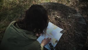 Download Stock Footage Woman Reading A Map In The Forest Live Wallpaper Free