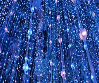 Download String Of Changing Color Lights Hanging From A Mirror Ceiling Live Wallpaper